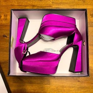 Brand new never worn closed toe magenta platform heels size 10